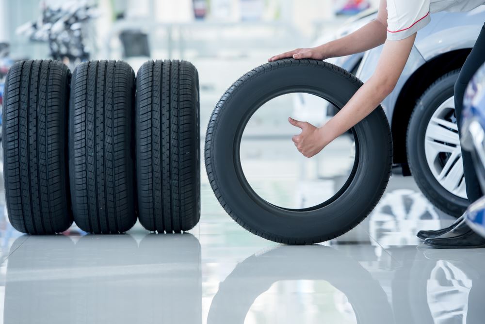 A guide to tire care, with new tires being inspected.