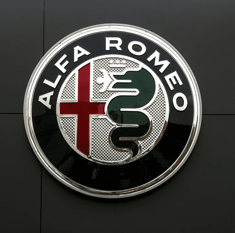 Close-up of an Alfa Romeo emblem representing specialized collision repair support available through Network Auto Body Inc.